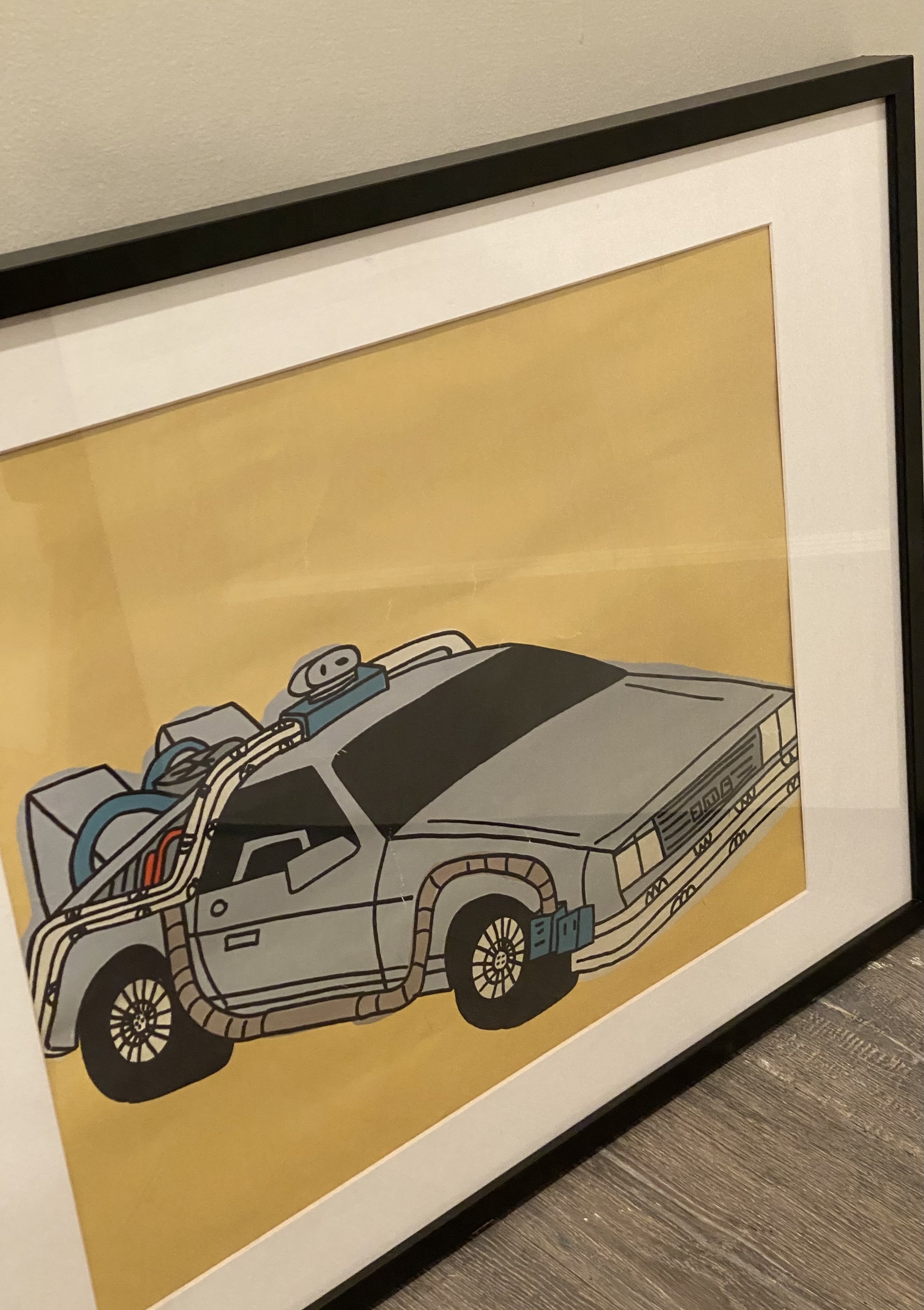 Rare Marz Jr. signed pop art of DMC DeLorean, framed and colorful, showcasing nostalgic design.